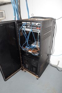 network cables in a blue-lit server room