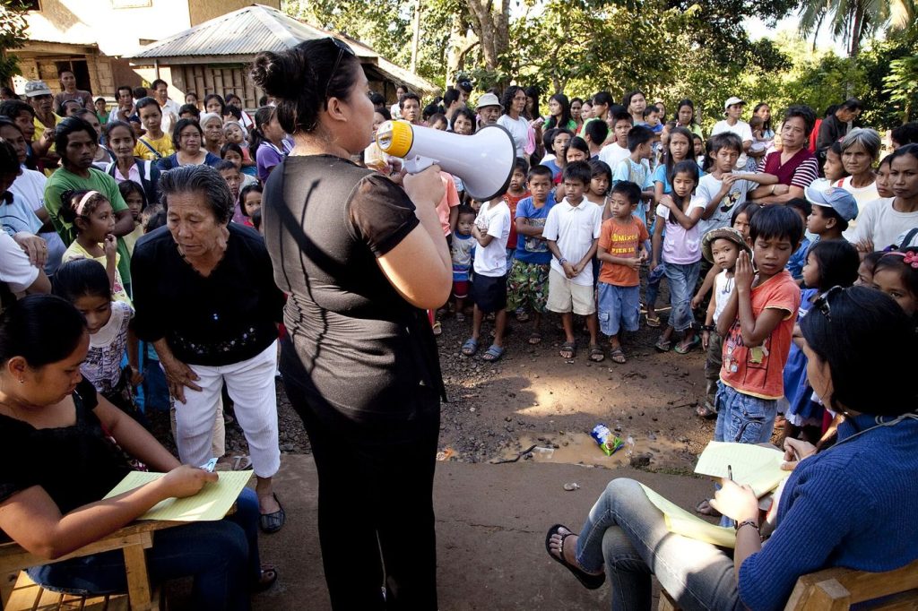 A doctor speaks with a patient during a screening appointment at a modern clinic.