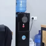 A water cooler in an office, where workplace drinking habits meet questions about plastic.