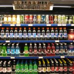Person comparing nutrition information on packaged food in a store